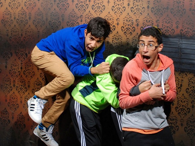 scared people at a haunted house